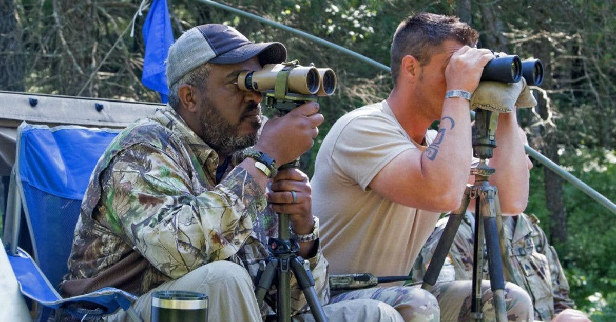 Staff Sgt. Joe Bastian and co-trainer Tarrol Peterson look for snipers during the 10-day sniper training course at Fort McCoy, Wisconsin.US Army photo by Sgt. 1st Class Brian Spreitzer