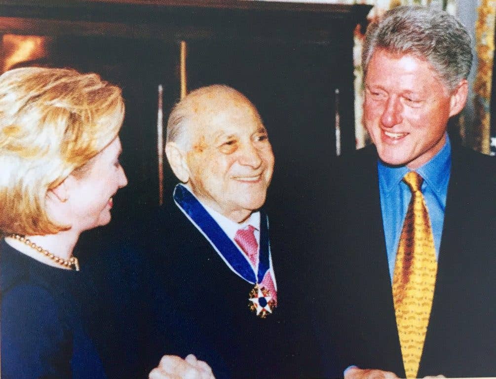 Zachary Fisher with President William J. Clinton and First Lady Hillary Rodham Clinton after receiving the Presidential Medal of Freedom for his lifetime of philanthropic work for military members and their families.