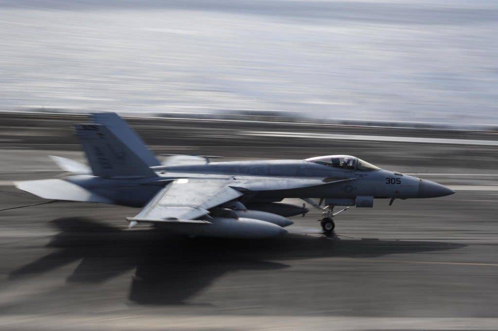 An F/A-18E Super Hornet assigned to the Knighthawks of Strike Fighter Attack Squadron (VFA) 136 lands on the flight deck of the Nimitz-class aircraft carrier USS Theodore Roosevelt (CVN 71). (U.S. Navy photo by Mass Communication Specialist 3rd Class Anthony N. Hilkowski/Released)