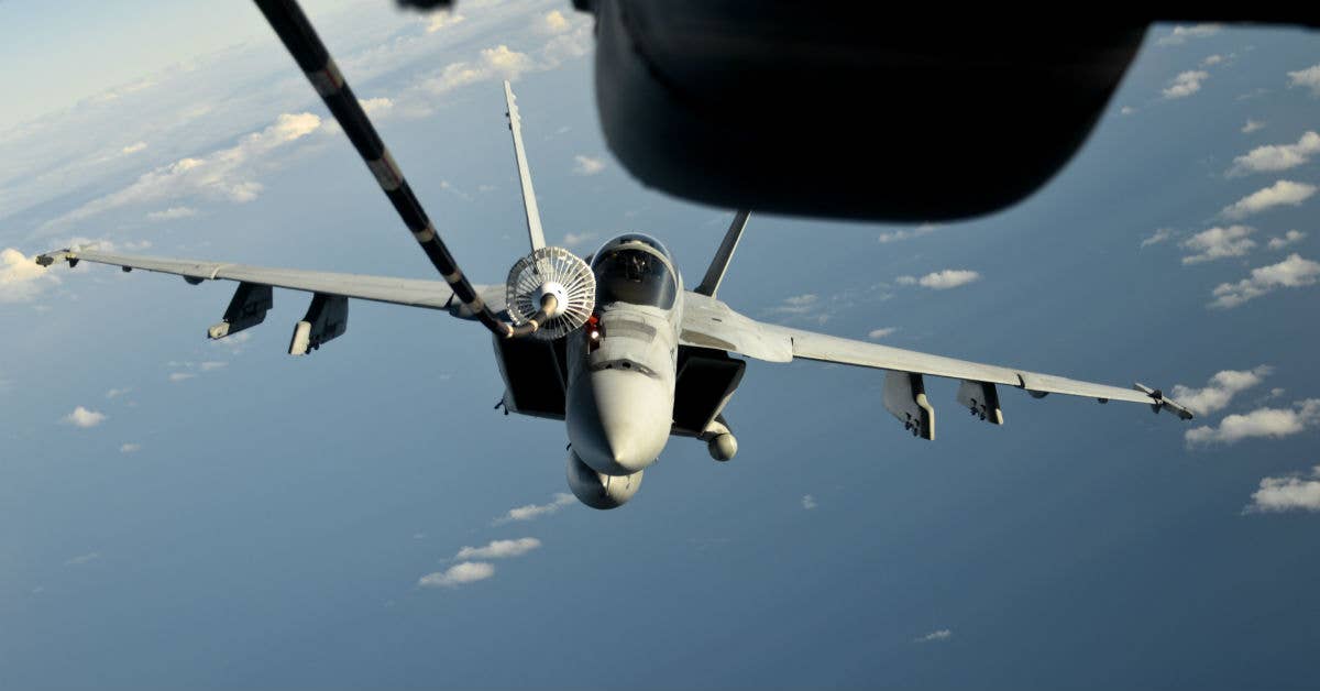 A KC-10 Extender from Travis Air Force Base, California, refuels a U.S. Navy F/A-18 Super Hornet over the Pacific Ocean July 14, 2017. (USAF photo by 2nd Lt. Sarah Johnson)