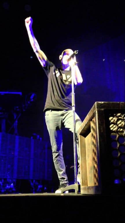 Chester talking in front of a San Diego crowd. (Photo via YouTube Screengrab)