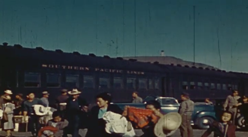 Japanese-Americans loading onto a train to relocate to the internment camps. (Source: History/Screenshot)