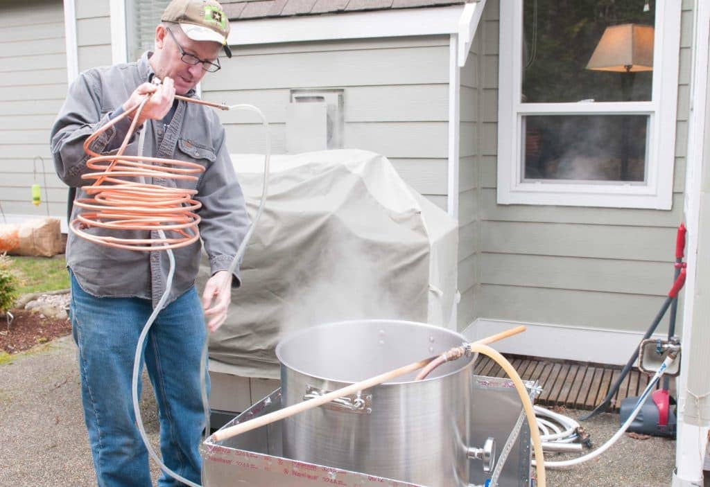 Col. John Kent, the deputy commanding officer of Madigan Army Medical Center prepares the wort chiller for entrance into the boiled wort during a home beer brewing session at his home in DuPont Wash., Feb. 25, 2017.