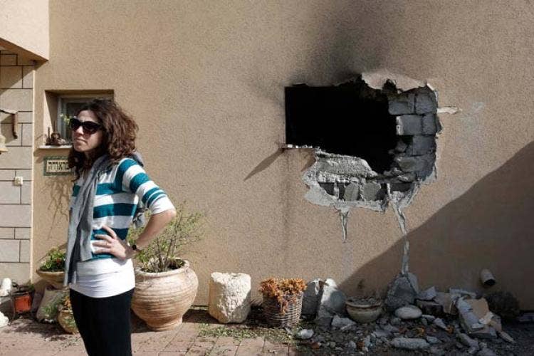 She seems more mildly annoyed at the rocket that just hit her house than she is afraid for her life. This is how common rocket attacks have become in Israel.