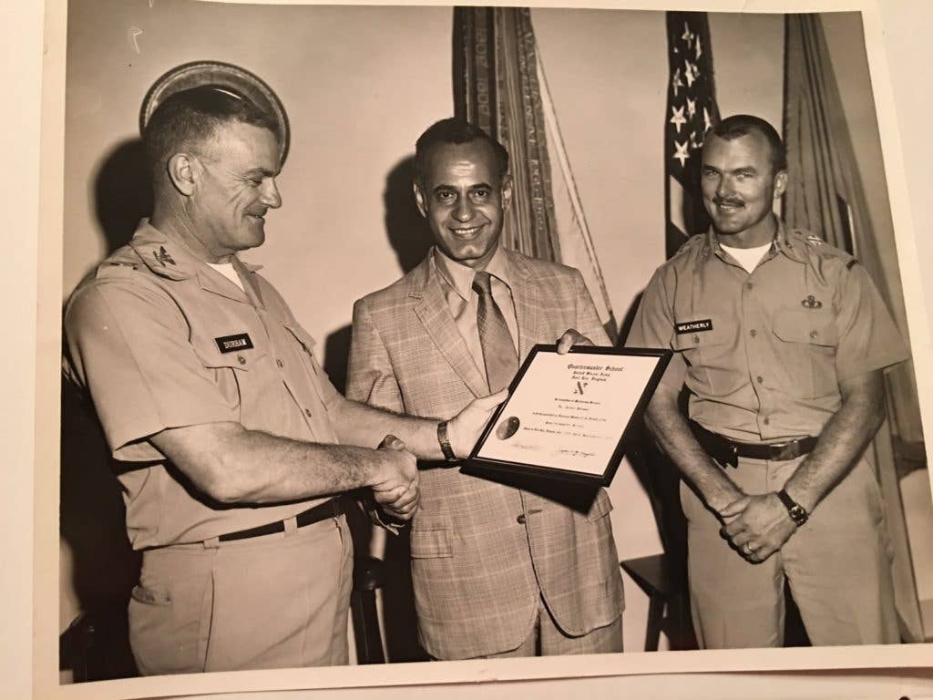 Dr. Rahman receiving the Meritorious Civilian Service Award for developing the MRE. And yes. His last name does sound like the instant noodles. There. That is now a thing you will remember.