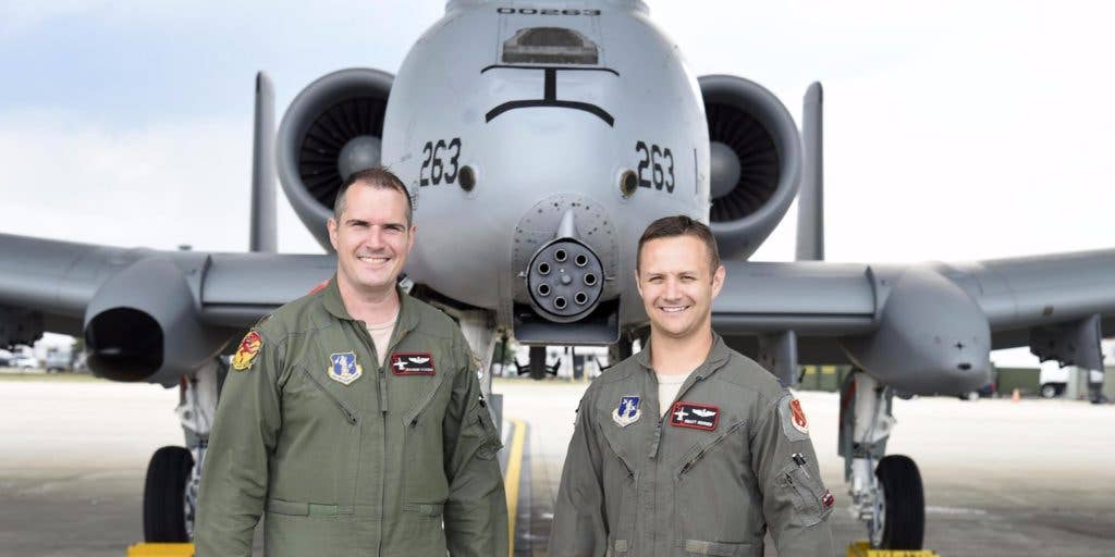 Capt. Brett DeVries (right) and his wingman Maj. Shannon Vickers, both A-10 Thunderbolt II pilots of the 107th Fighter Squadron from Selfridge Air National Guard Base, Mich. Vickers helped DeVries safely make an emergency landing July 20 at the Alpena Combat Readiness Training Center after the A-10 DeVries was flying experienced a malfunction. | US Air National Guard photo by Terry Atwell