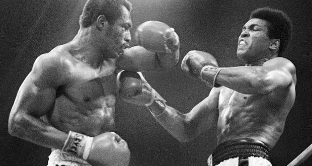 Muhammad Ali (right) winces as Ken Norton (left) hits him with a left to the head during their re-match at the Forum in Inglewood. (AP Photo/File)