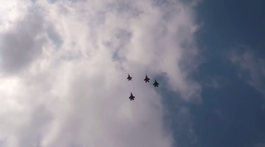F-35 Lightning II fighters fly the missing man formation during the funeral of 2nd Lt. Charles E. Carlson. (Youtube Screenshot)