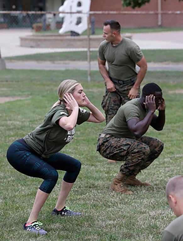 Marine Corps fitness instructors bang out some squats with supermodel Kate Upton. (Photo from AP via News Edge)