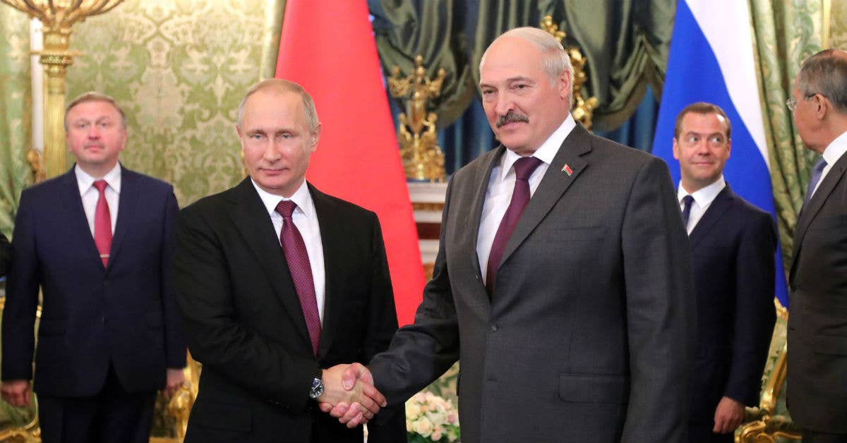 Russian President Vladimir Putin (left) shakes hands with President of Belarus, Alexander Lukashenko. Photo from Russian Kremlin.