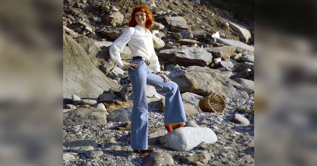 A girl in the 1970s sporting some fashionable bell buttons near a beach. (Source: Wikipedia Commons)