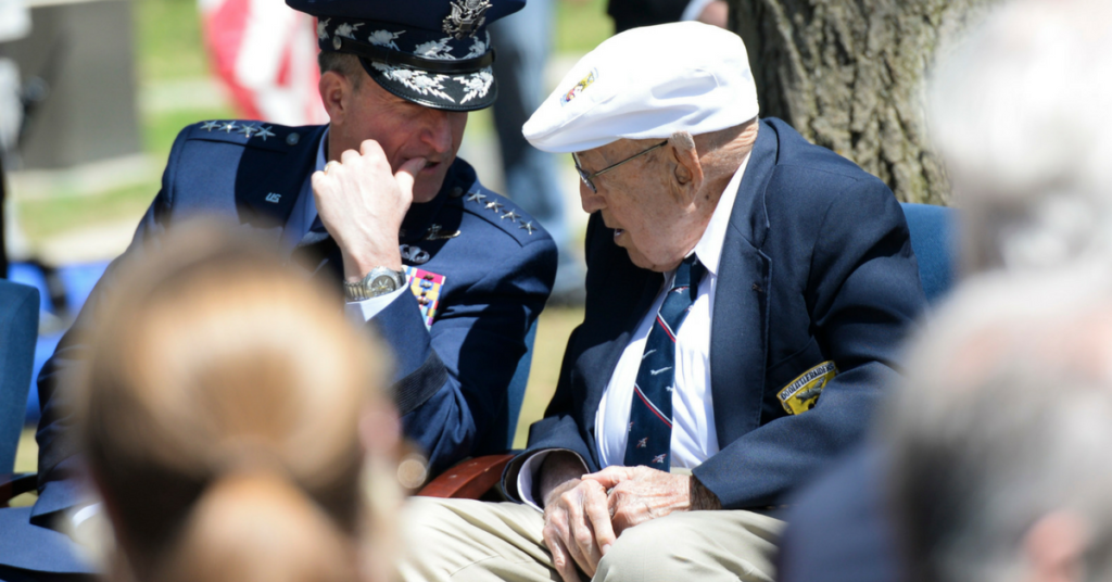 Chief of the Staff of the Air Force, Gen. David L. Goldfein, talks to Lt. Col. (Ret.) Richard E. Cole, the sole surviving member of the Doolittle Raiders (right) during the 75th Anniversary of the Doolittle Raid Memorial Ceremony at the National Museum of the United States Air Force, April 18, 2017. Also attending was Jeff Thatcher (left), the son of Doolittle Raider Staff Sgt. David Thatcher, who passed in June 2016. (U.S. Air Force Photo/ Wesley Farnsworth)