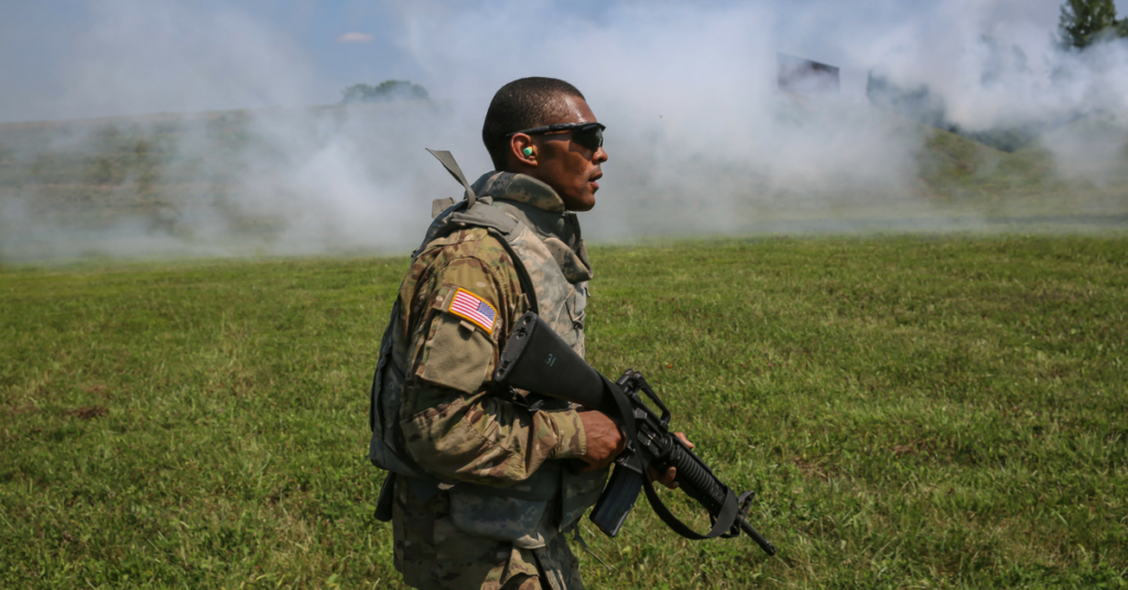 U.S. Army Staff Sgt. Qujuan Baptiste uses smoke as concealment during a stress shoot at the 2017 Army Materiel Command's Best Warrior Competition July 18, 2017, at Camp Atterbury, Indiana. (U.S. Army photo by Sgt. 1st Class Teddy Wade)