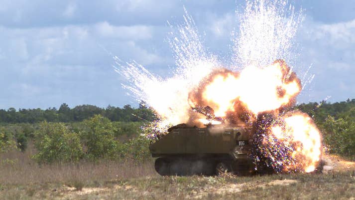 An Advanced Precision Kill Weapon System rocket exploding in an armored personnel carrier. (BAE Systems photo)