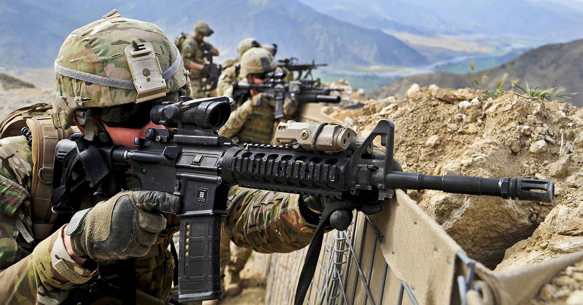 <em>A soldier with an M4 loaded with a PMAG (U.S. Army)</em>
