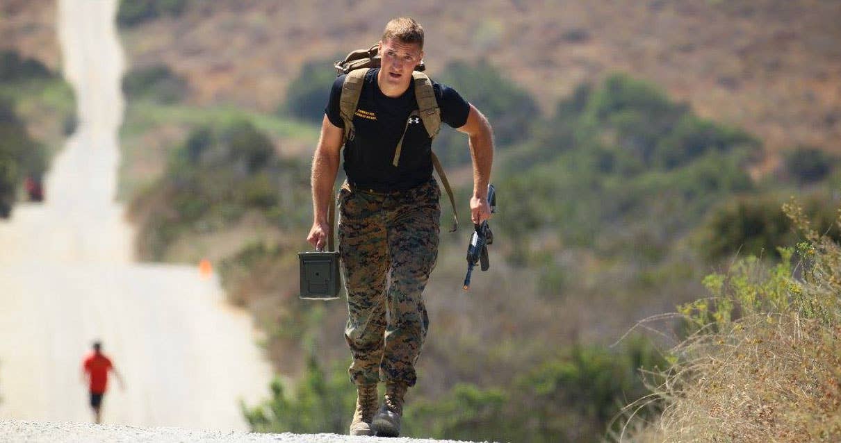 USMC Sgt. Ethan Mawhinney, a Marine Air Ground Task Force planner with U.S. Marine Corps Forces, Special Operations Command, competes in an 880-meter Tactical Hill Climb. Photo by MCCS Camp Pendleton.