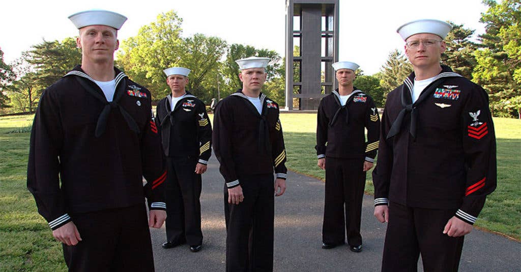 These sailors stand proud sporting their inspection ready dress blues.