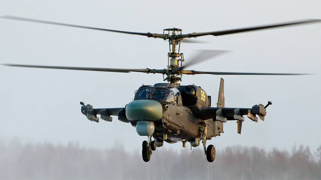 This video of a Russian helicopter accidentally firing on observers is crazy