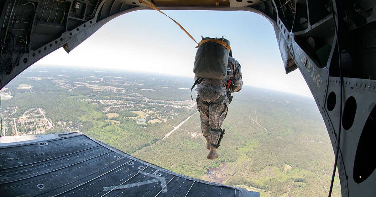 US Army 1st Lt. Andrew McCornack, a jumpmaster with the 1st Brigade Combat Team, 82nd Airborne Division exits a CH47 Chinook helicopter. US Army photo by Sgt. Michael J. MacLeod.