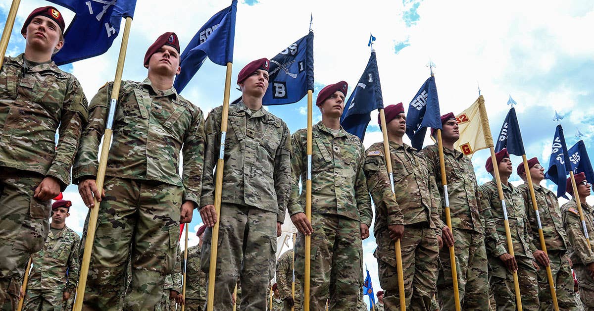 Paratroopers assigned to the 3rd Brigade Combat Team, 82nd Airborne Division stand ready with their unit guidons during the All American Week Airborne Review at Fort Bragg, N.C., May 25, 2017. US Army photo by Staff Sgt. Anthony Hewitt.