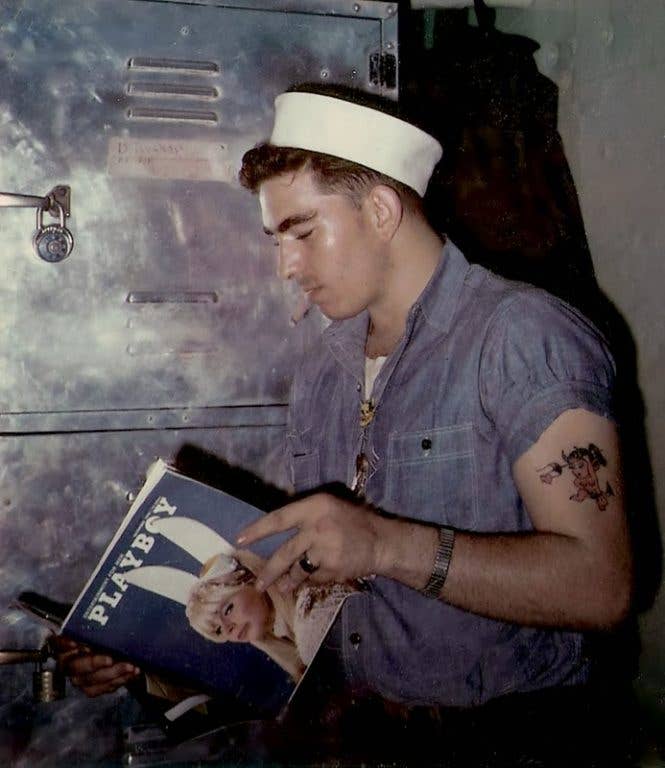 A sailor reading Playboy in the 1950s.