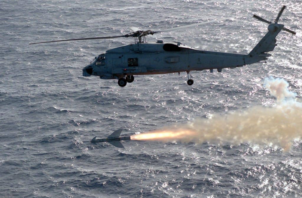 A Knox-class frigate used as a target ship never had a chance against this SH-60B helicopter from HSL 47. The AGM 119 Penguin missile it was carrying hit the target 24 inches above the waterline. HSL 47 is deployed in the Pacific Ocean for RIMPAC 98. (DOD photo)