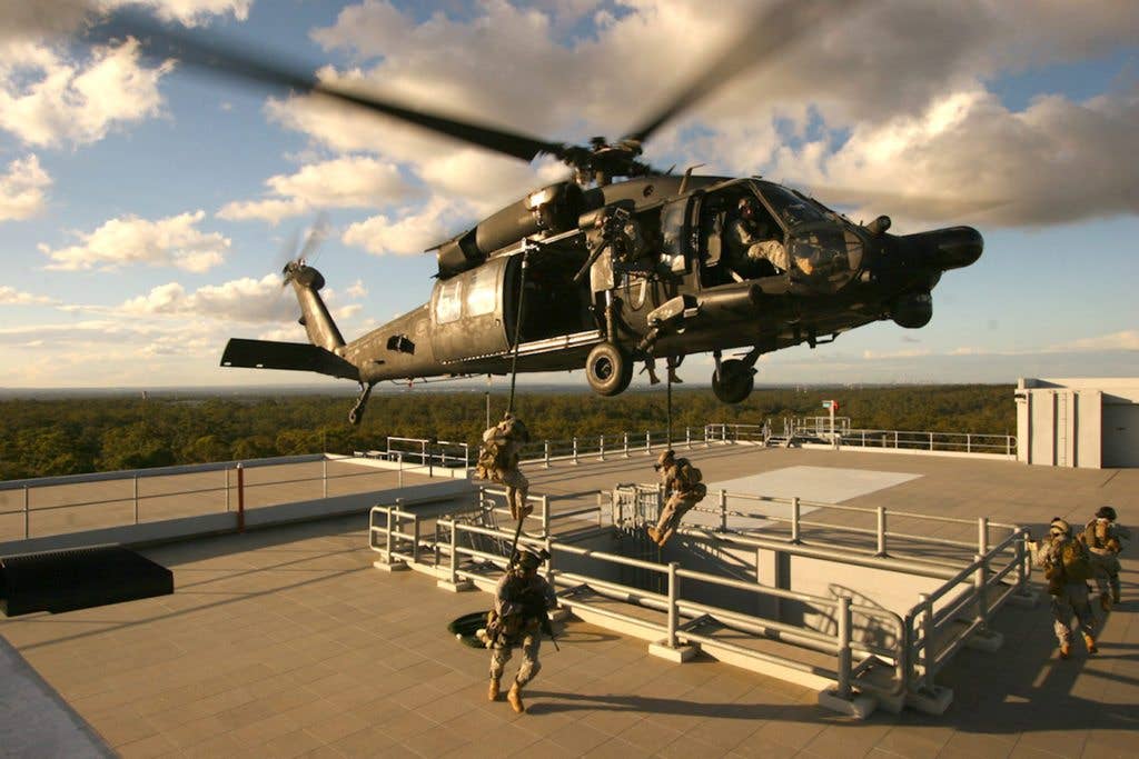 Special Operations Soldiers fast-rope from an MH-60 from the 160th Special Operations Aviation Regiment(SOAR) to an objective. (US Army photo)