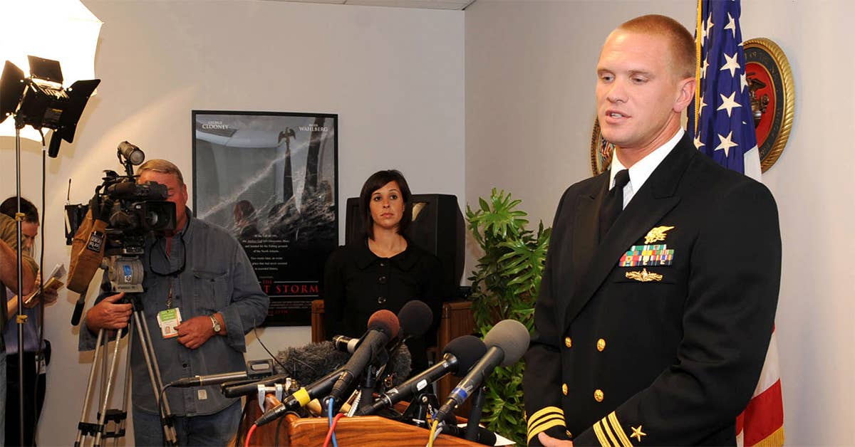 Navy SEAL Lt. Cmdr. Seth Stone speaks to the media about Master-At-Arms 2nd Class (SEAL) Michael A. Monsoor who was posthumously awarded the Medal of Honor. Navy photo by Mass Communication Specialist 3rd Class Michelle L. Kapica.