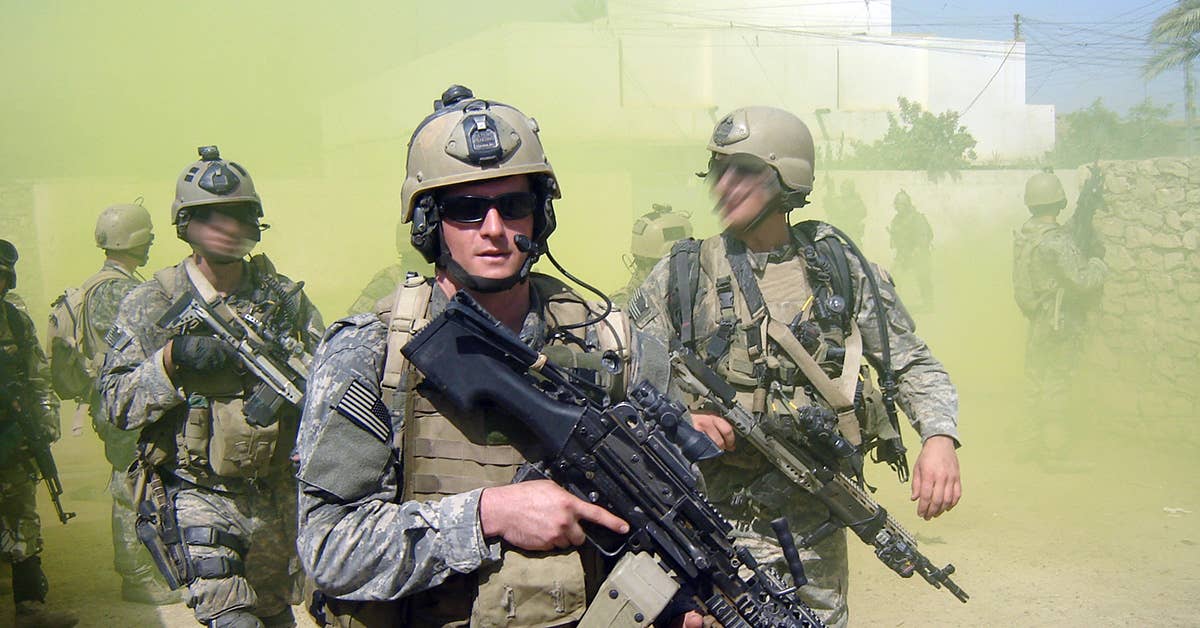In an undated file photo provided by the US Navy, Petty Officer 2nd Class Michael A. Monsoor participates in a patrol in support of Operation Iraqi Freedom. Monsoor has been awarded the Medal of Honor.