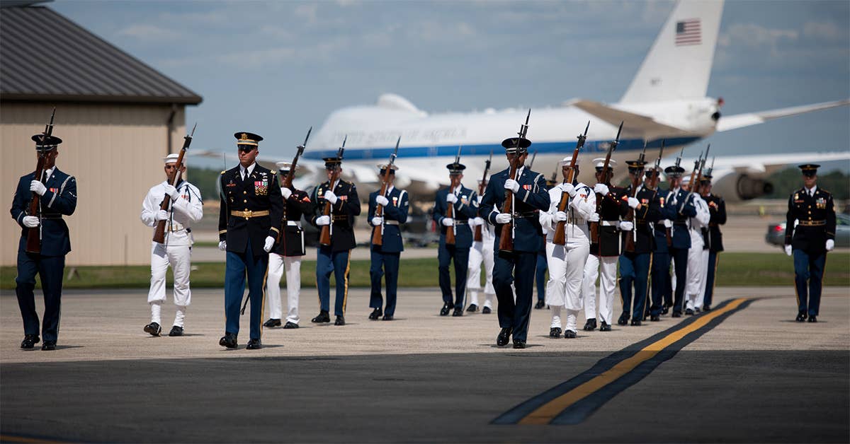 The United States Air Force Band plays the national anthem during the dignified transfer of the remains J. Christopher Stevens, U.S. ambassador to Libya, and three other Americans, Sept. 14, 2012, at Joint Base Andrews, Md. USAF photo by Senior Airman Perry Aston.