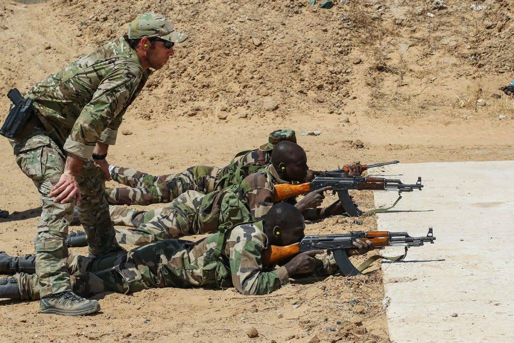 A U.S. Army Special Forces weapons sergeant observes a Niger Army soldier during marksmanship training as part of Exercise Flintlock 2017 in Diffa, Niger, Feb. 28, 2017. Niger was one of seven locations to host tactical-level training during the exercise while staff officers tested their planning abilities at a simulated multinational headquarters in N'Djamena, Chad. (U.S. Army photo by Sgt. 1st Class Christopher Klutts)