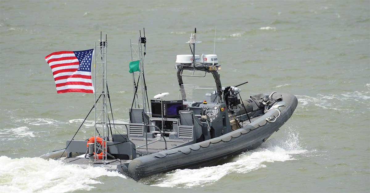 An unmanned 11-meter rigid hulled inflatable boat (RHIB) from Naval Surface Warfare Center. Navy photo by John F. Williams.