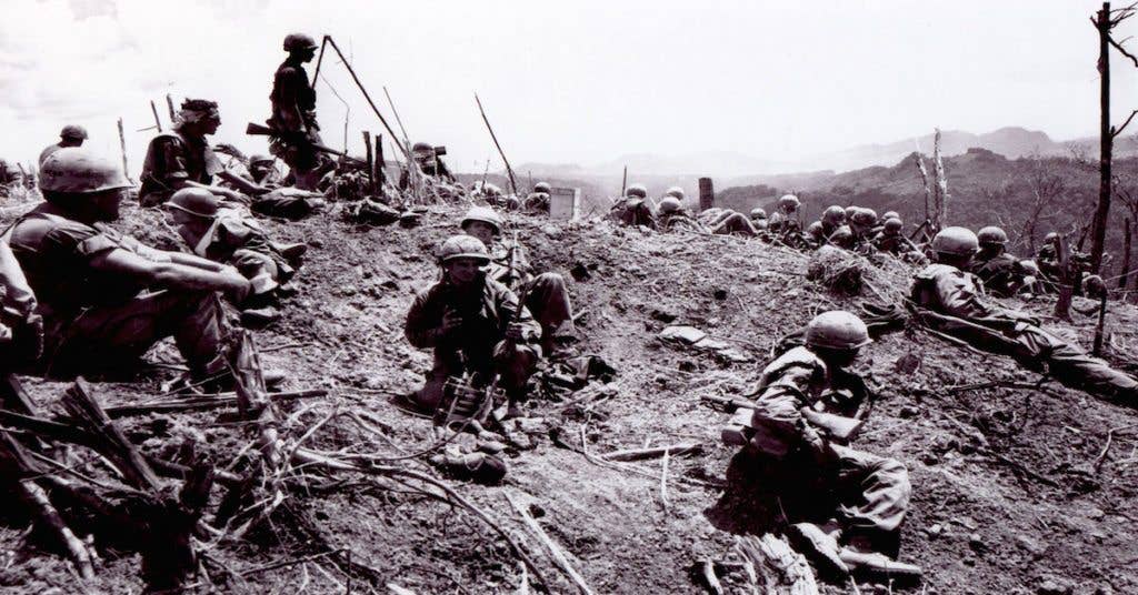 U.S. troops positioned on the top of Hill 937.