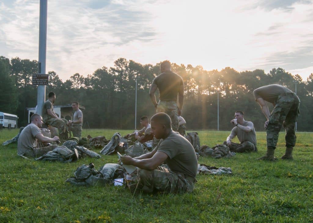 Noncommissioned officers and Soldiers take a break to recover after completing the Soldier Readiness Test during the 2017 Forces Command Best Warrior Competition at Fort Bragg, N.C., Aug. 20. | U.S. Army photo by Spc Liem Huynh