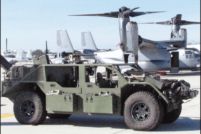 A Flyer 60 with a M2 heavy machine gun. This vehicle can be carried in a V-22 Osprey like the one in the background. (Photo by General Dynamics)