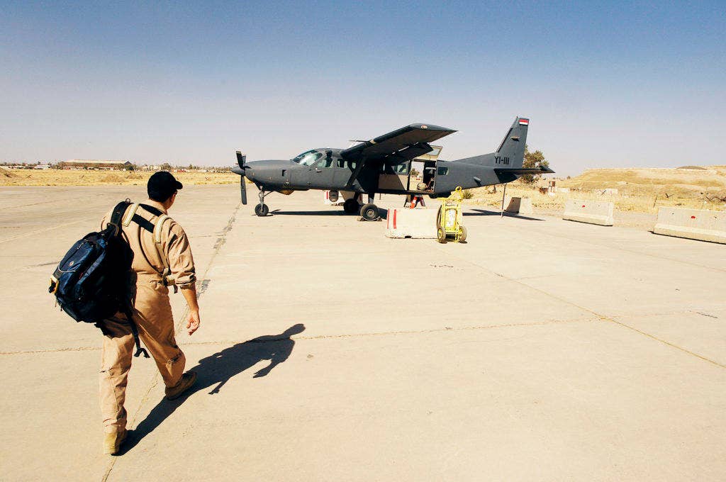 An Iraqi pilot walks to a Iraqi AC-208 Caravan for a training mission at Kirkuk Regional Air Base, Iraq. For the first time since the re-formation of the Iraqi air force, an Iraqi pilot fired a missile from an a AC-208 Nov. 04, 2009, at a target on a bombing range near Al Asad Air Base, Iraq. (Photo: U.S. Air Force Staff Sgt. Aaron Allmon)