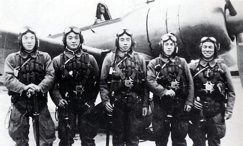 Kamikaze pilots pose together in front of a zero fighter plane before taking off from the Imperial Army airstrip on &nbsp;Nov. 8, 1944.