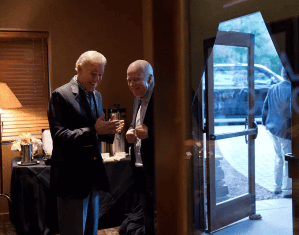 Then Vice-President Joe Biden and Sen. John McCain share a laugh behind the scenes.