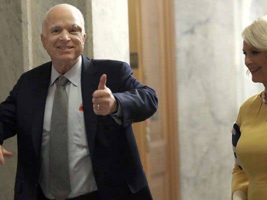 Senator McCain can't fully raise his arms due to injuries he suffered as a POW.