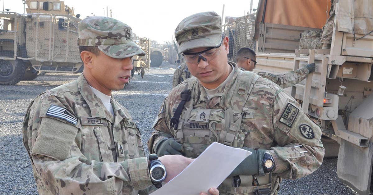 Sgt. 1st Class Christopher D.L. Perez (left) and Staff Sgt. Charles C. Chiguina discuss a route to a Kabul airport to drop off the first group of Task Force Guam Soldiers who are leaving Afghanistan after the 1st Battalion, 294th Infantry Regiment, Guam Army National Guard, nears completion of its Operation Enduring Freedom mission. (Photo Credit: Sgt. Edward Siguenza)