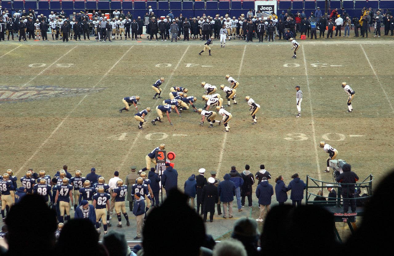 A play from scrimmage during the 2002 Army-Navy game. Navy won, 58-12, after an incident where Army cadets stole the Navy's mascot. (US Navy photo)