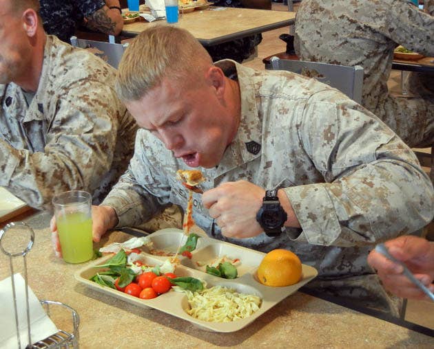 Look at him. He either loves it or is just trying to struggle through another meal. (U.S. Marine Corps photo)