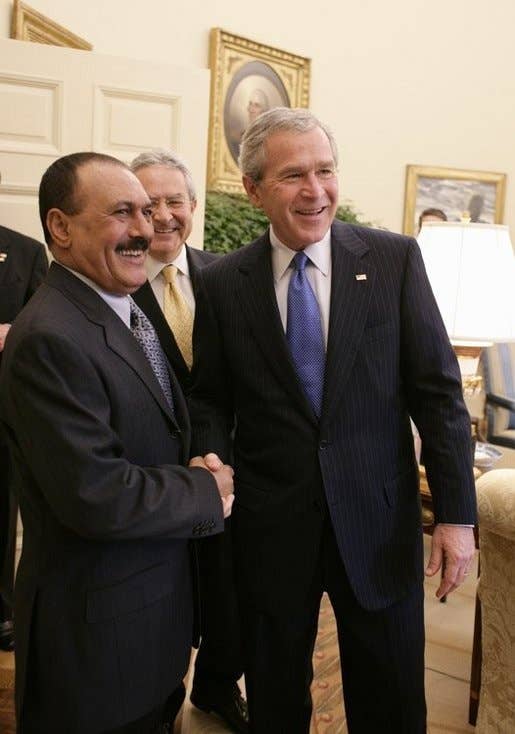 President George W. Bush welcomes Yemen President Ali Abdullah Saleh into the Oval office of the White House, Thursday, Nov. 10, 2005. (White House photo by Eric Draper)