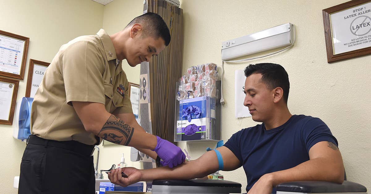 Hospital Corpsman 1st Class Oliver Arceo draws blood for a Sailor's annual Human Immunodefificiency Virus (HIV) test at North Island Medical Clinic, Naval Air Station North Island, Coronado, Calif. (U.S. Navy photo by Mass Communication Specialist 1st Class Marie A. Montez)