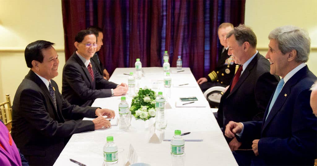 Kem Sokha, Acting President of the Cambodia National Rescue Party and the country's opposition leader, sits across from former Secretary of State John Kerry. (Photo from U.S. State Department)