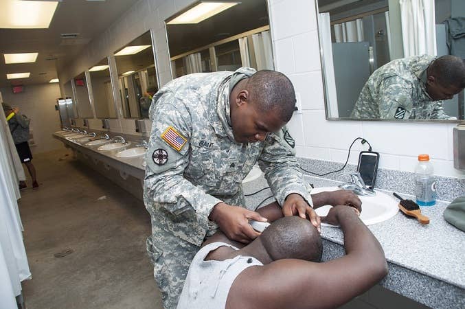 If your hair is out of regs, find the barracks barber. There's one in every unit. (Photo by Sgt. Ferdinand Thomas II, PAO)