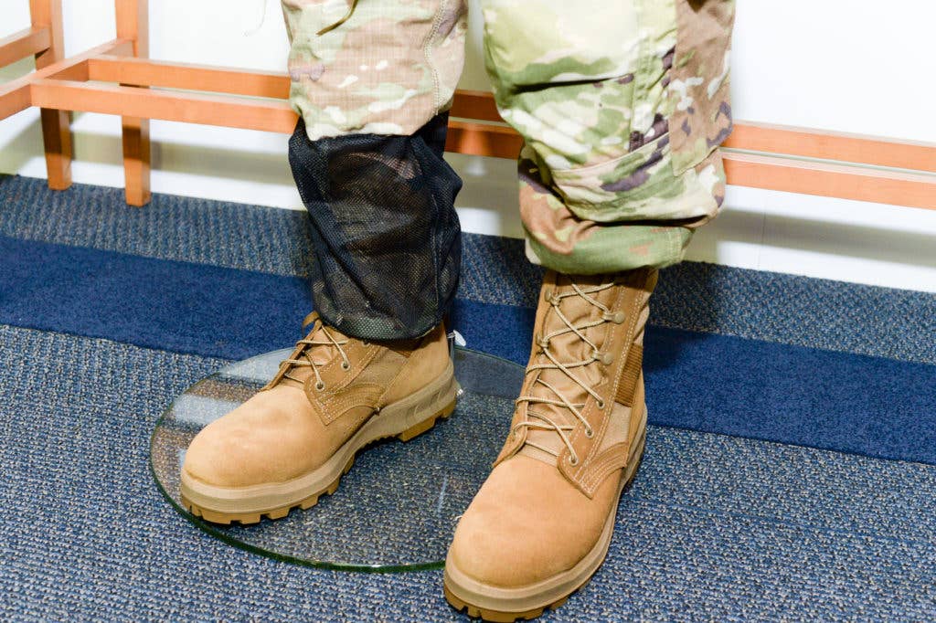 Program Executive Office Soldier officials discussed improvements to the hot weather uniform and jungle combat boot programs during a media roundtable event on Fort Belvoir, Va., Dec. 7, 2017. The 25th Infantry Division is slated to field test the new uniform and boot starting in January. (U.S. Army photo by Devon L. Suits)