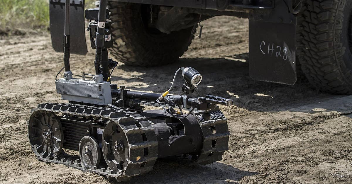 Army Reserve Sgt. Santiago Zapata, 2nd Platoon, 323rd Engineering Clearance Company, operates the Talon tracked military robot by using a ground remote on a route clearance mission while at the Combat Support Training Exercise at Fort McCoy, Wis., June 19, 2015. (DoD photo by Sgt. 1st Class Brian Hamilton)