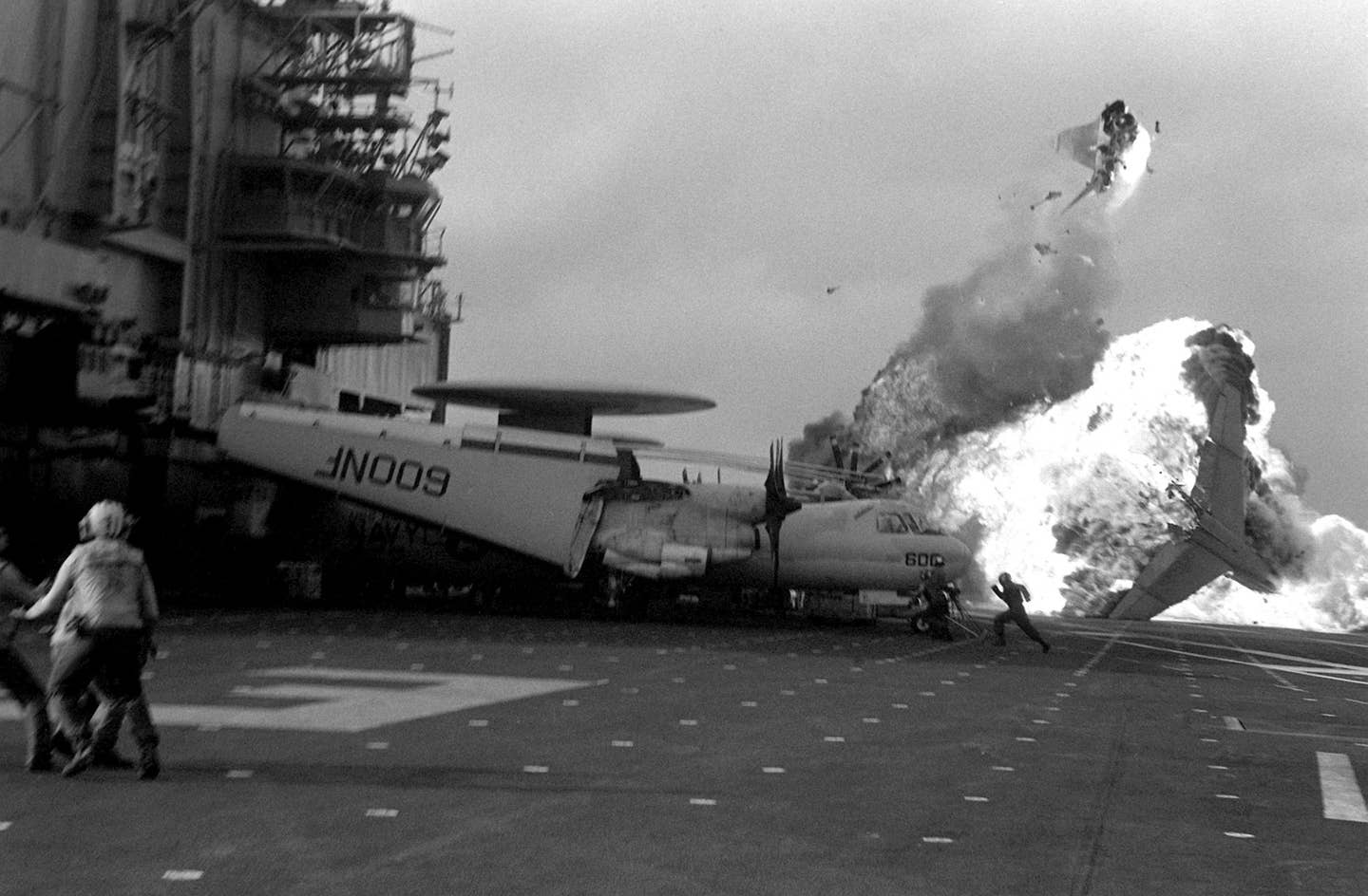 An Attack Squadron 56 (VA-56) A-7E Corsair aircraft bursts into flames after a ramp strike on the aircraft carrier USS MIDWAY (CV-41). (U.S. Navy photo)