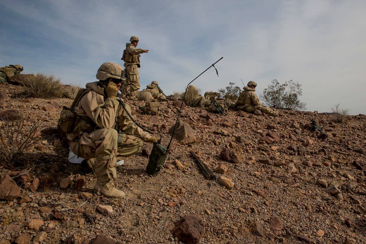 U.S. Marine Corps Capt. Benjamin Brewster, company commander of Company K, 3rd Battalion, 4th Marine Regiment, 1st Marine Division (MARDIV), directs his fire support team during exercise Steel Knight (SK) 18 at Marine Corps Air Ground Combat Center Twentynine Palms, Calif., Dec. 10, 2017. SK-18 is a division-level exercise designed to enhance the command and control and interoperability with the 1st MARDIV, its adjacent units, and naval support forces. (U.S. Marine Corps photo by Cpl. Joseph Prado)